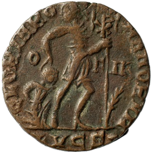Gloria Romanorum: The Roman Emperor Gratianus (367-383 AD) dragging along a captured barbarian. Late Roman bronze coin reverse. 
